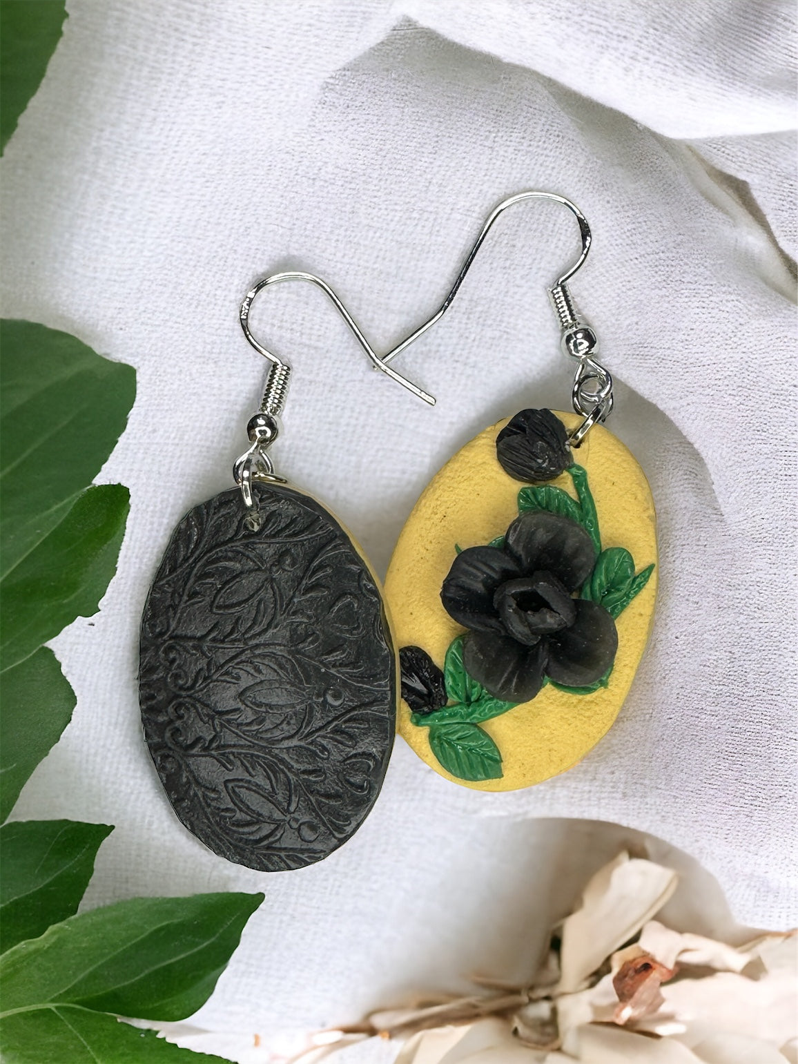 Pale yellow and black floral earrings